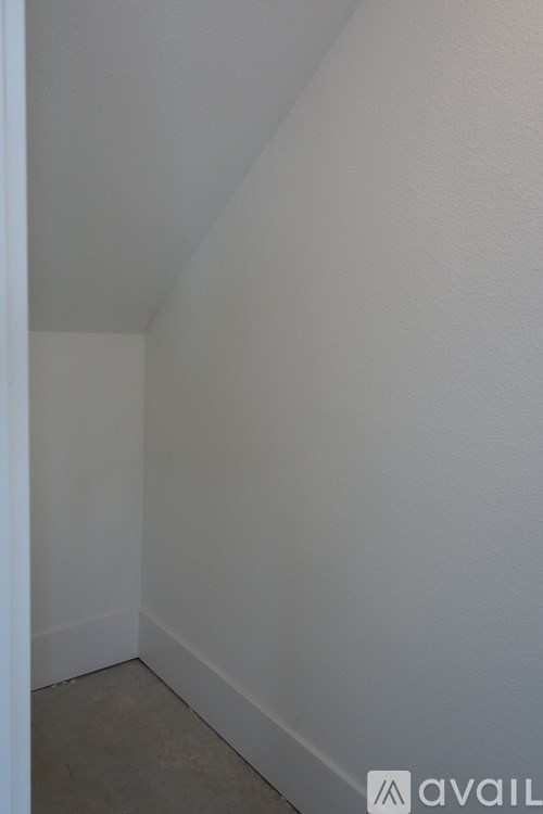 A room with white walls and a white ceiling.