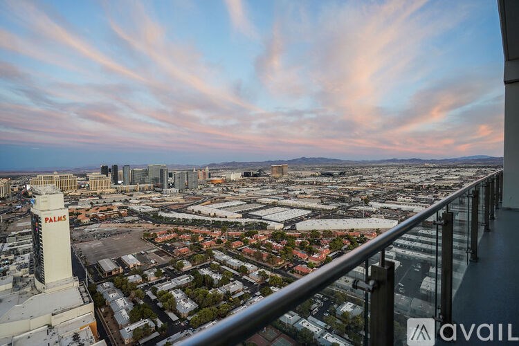 A view from a high vantage point looking down at a cityscape with the Palms Hotel and Casino prominently featured.