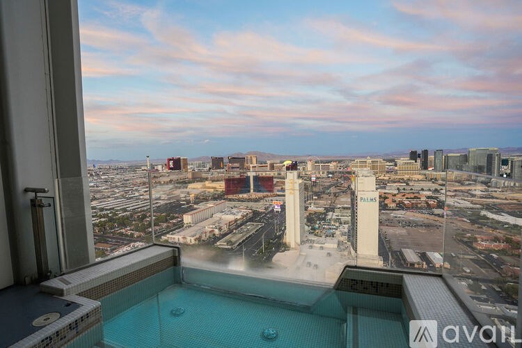 A view from a high-rise building overlooking a cityscape.