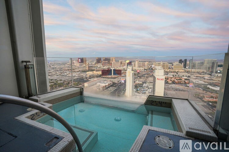 A view from a high-rise building overlooking a cityscape.