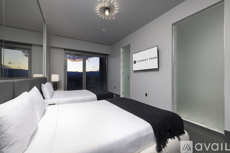 A bedroom with a large bed and a sign that says "TURNER PADS".