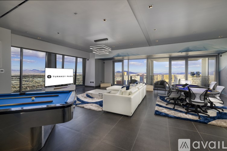 A room with a pool table and a sign that says "Turney Park".