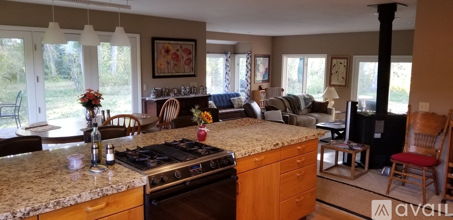 A kitchen with a stove top oven and a counter top.