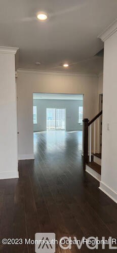 A room with wooden floors and white walls.