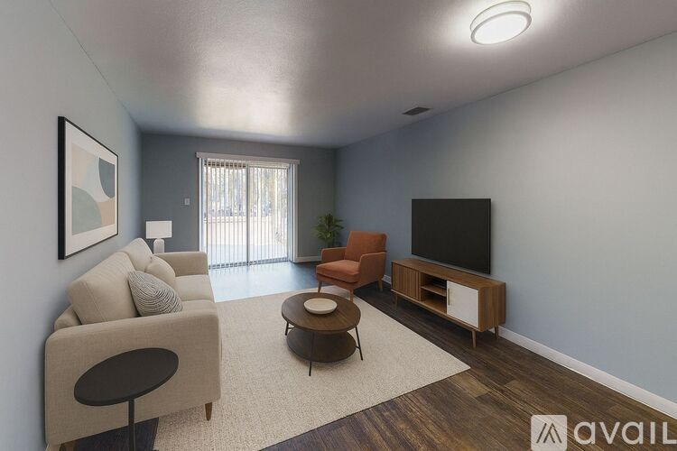 A room with a ceiling fan and a door leading to another room.