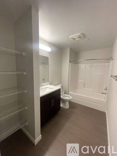 A bathroom with a walk-in shower and a toilet.