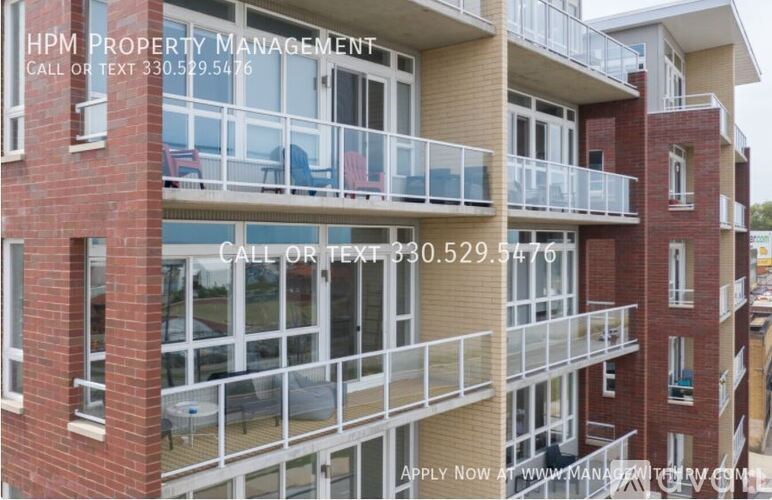 A building with the text "HPM PROPERTY MANAGEMENT" on it.