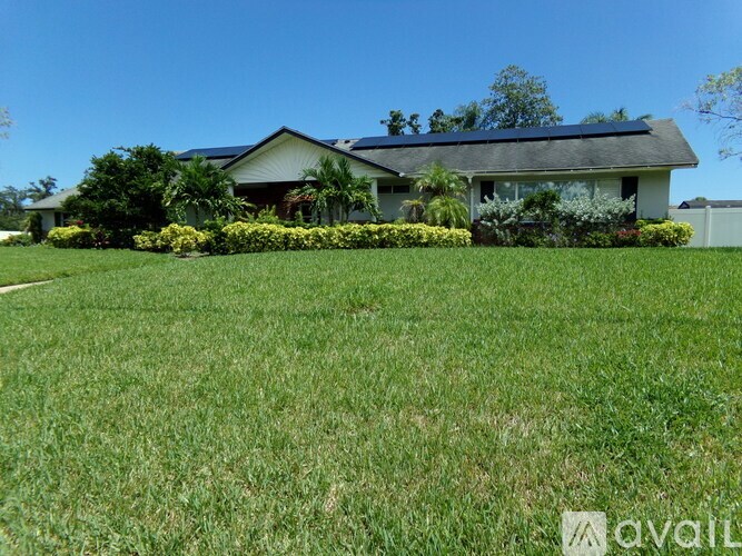 A house with a lawn in front of it.
