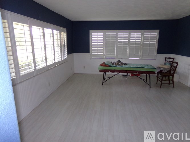 A room with a table and chairs in it.