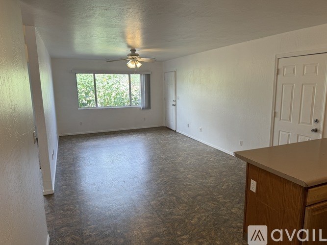 A bathroom with a toilet, sink, and bathtub.
