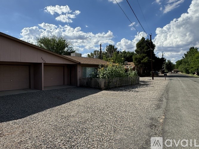 A room with a white door and carpeted floor.