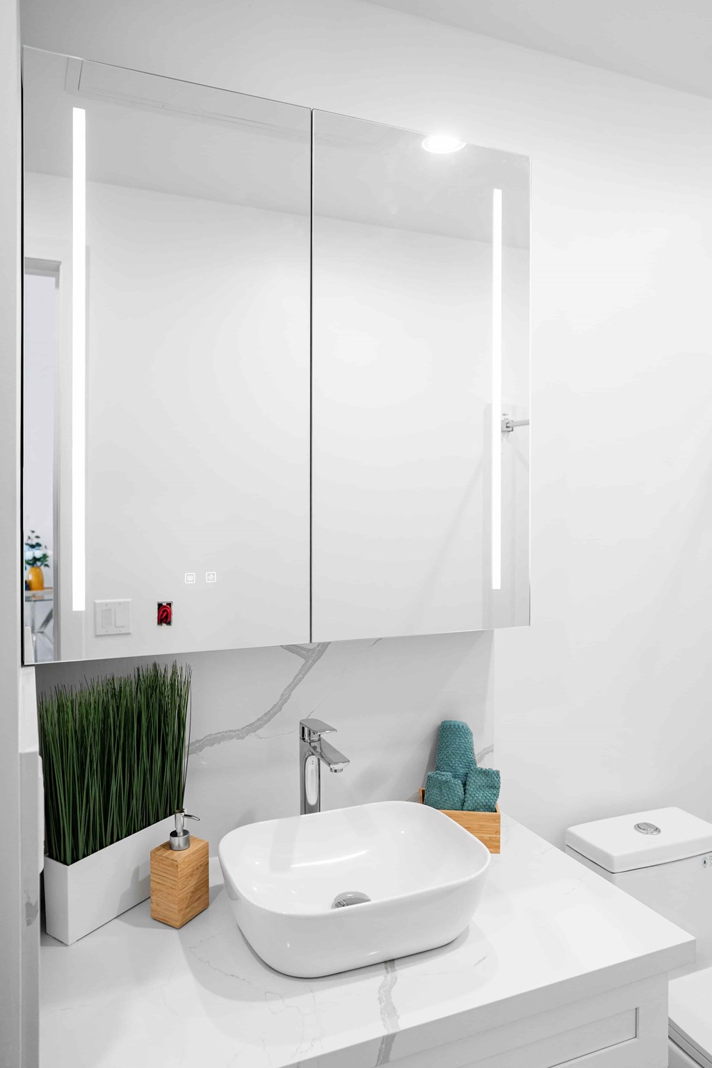 A white sink in a modern bathroom.
