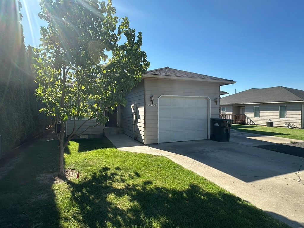 A house with a tree in front of it.