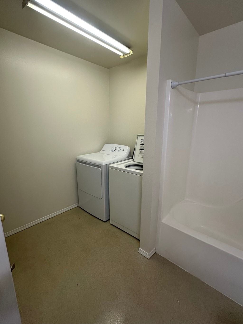 A small white bathroom with a toilet and sink.