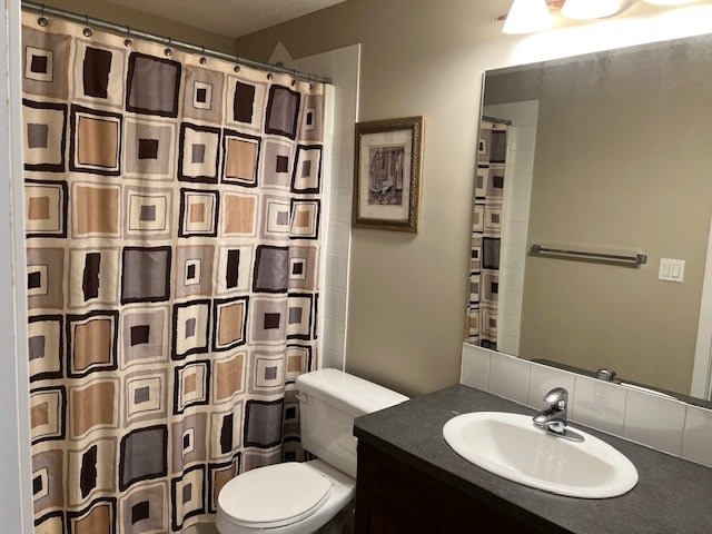 A bathroom with a toilet, sink, and shower curtain.
