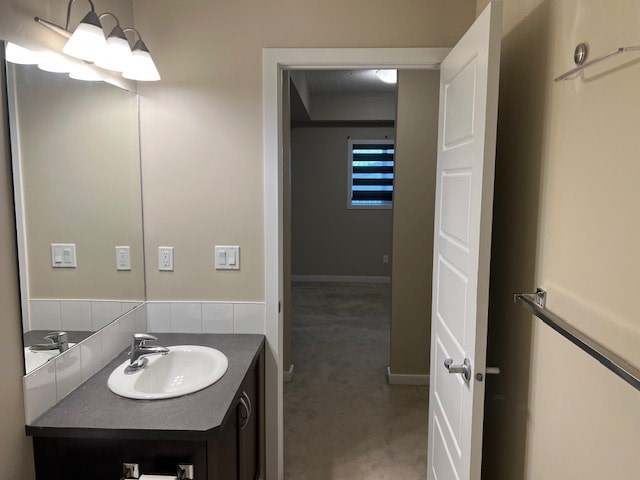 A bathroom with a sink and mirror.