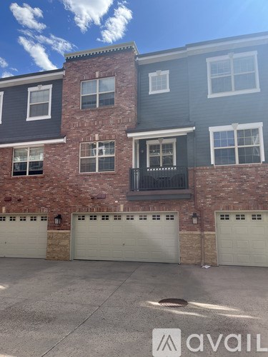 A bathroom with a toilet, sink, and shower.
