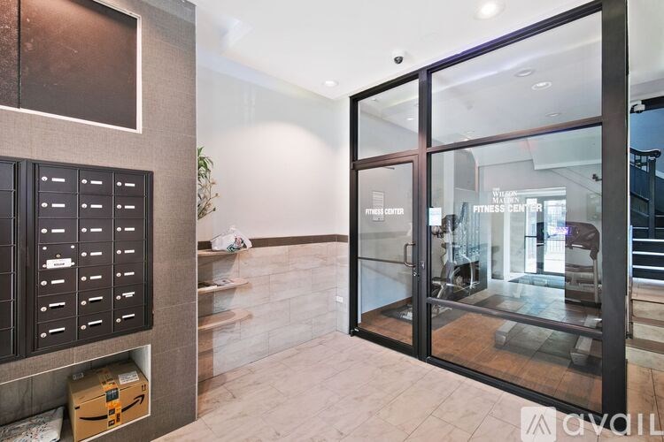 A gym with a glass door entrance.