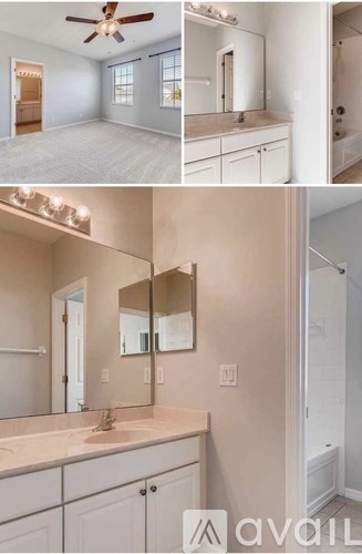 A bathroom with a vanity and a fan.