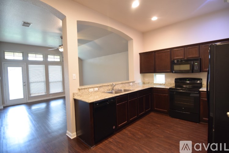 A bathroom with a vanity, toilet, and sink.