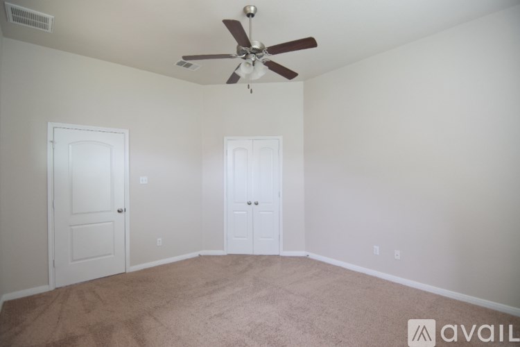 A bathroom with a tub, shower, and a window.