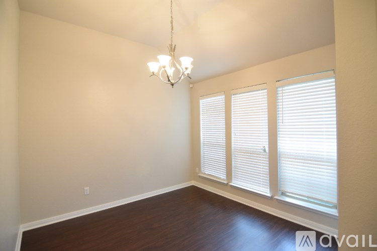 A kitchen with a granite counter top and a white door.