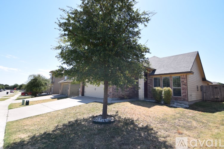 A red brick house with a glass window and a door.