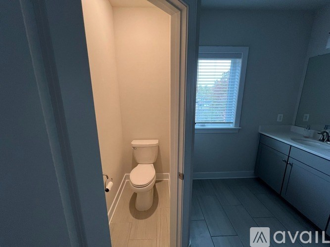 A bathroom with a toilet and a sink.