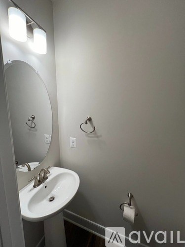 A bathroom with a sink and mirror.