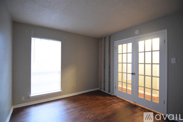 A room with a window and a door.