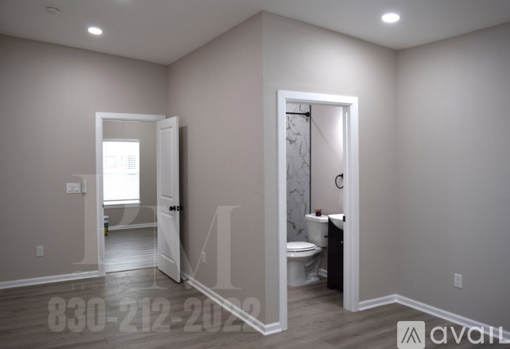A bathroom with a toilet and a sink is shown.