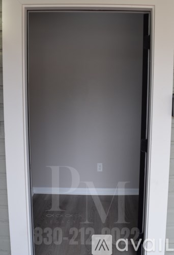 A window with a phone number and logo on it.