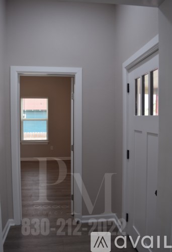 A room with a door leading to a balcony.