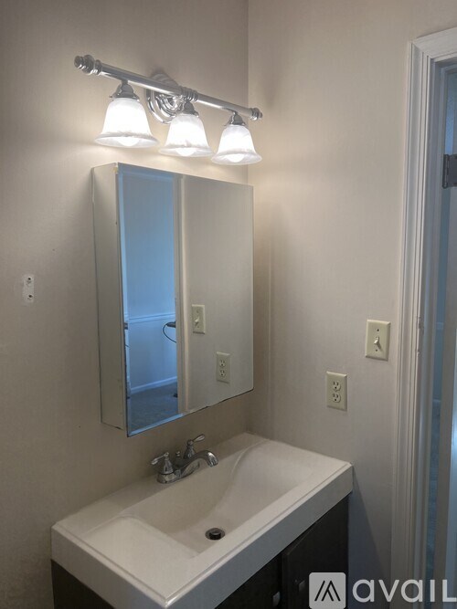 A bathroom sink with a mirror above it.