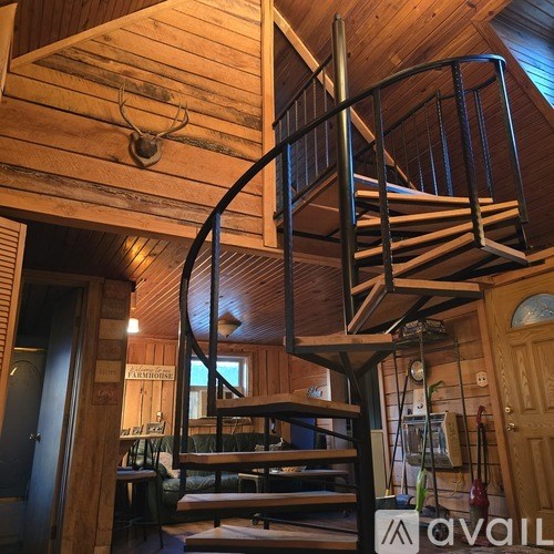 A spiral staircase in a wooden building.