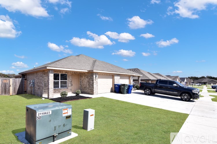 A house with a utility box in front of it.