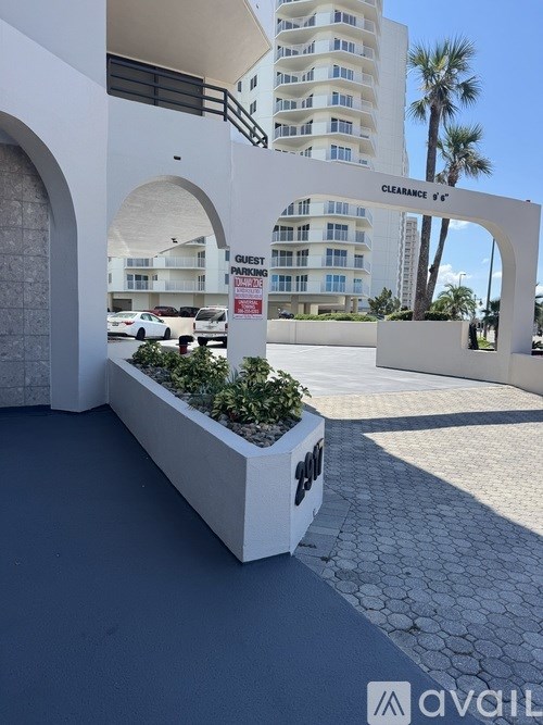 A white building with a sign that says "CLEARANCE" on it.