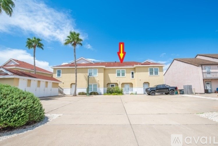 A two-story house with a white door and windows.