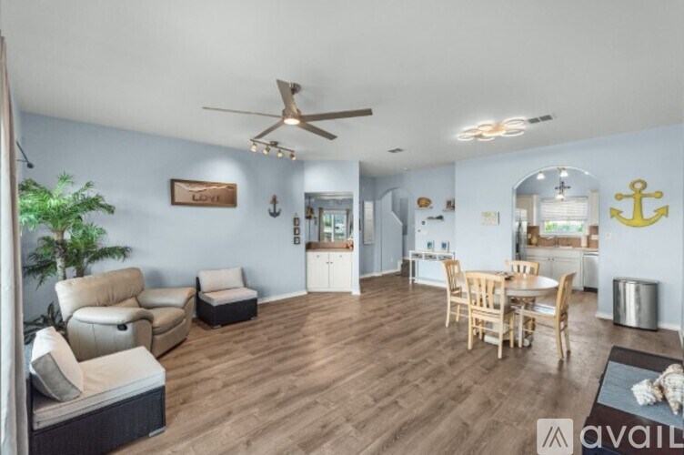 A wooden dock with a metal railing and a white post.