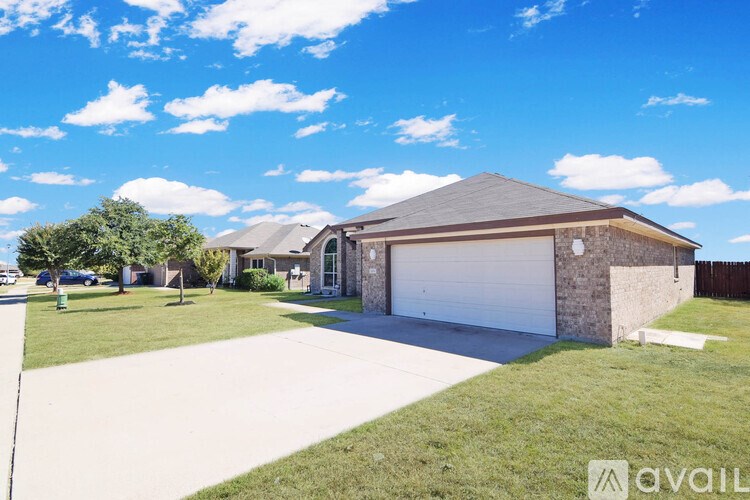 A house with a garage is available for sale.