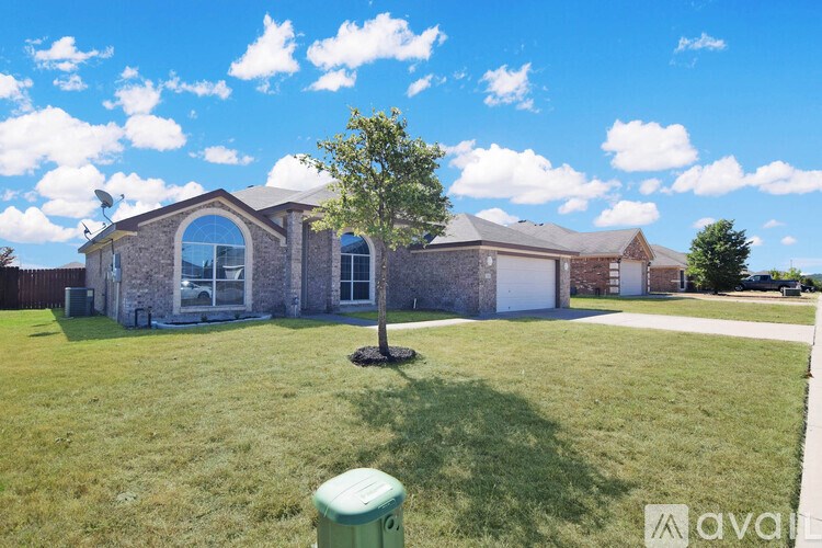 A house with a tree in front of it.