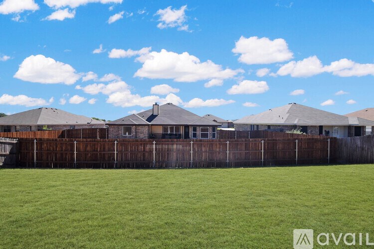 A spacious room with a ceiling fan and tiled flooring.