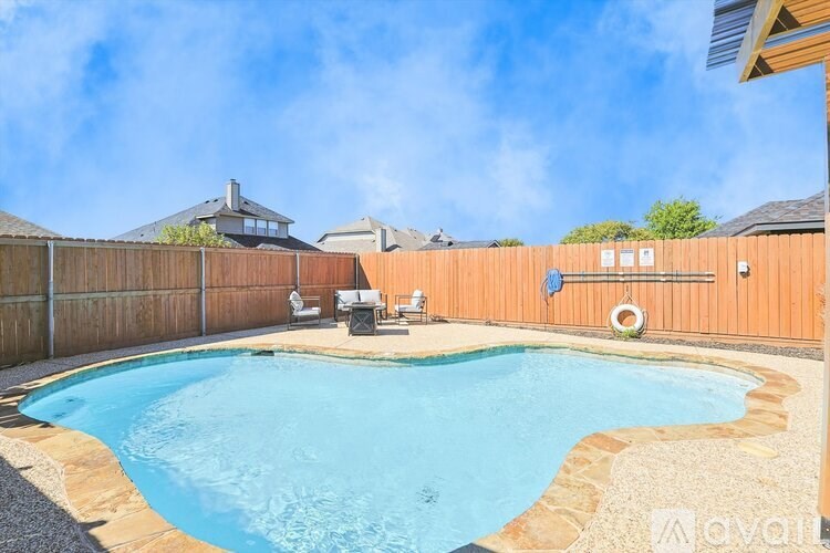 A small kidney-shaped pool with a stone border.
