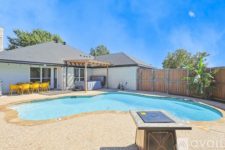 A house with a pool in the backyard.
