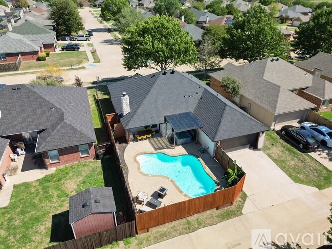 A house with a pool in the backyard.