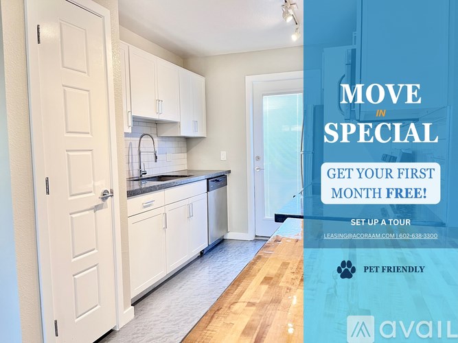 A kitchen with a sign offering a free first month for moving in.