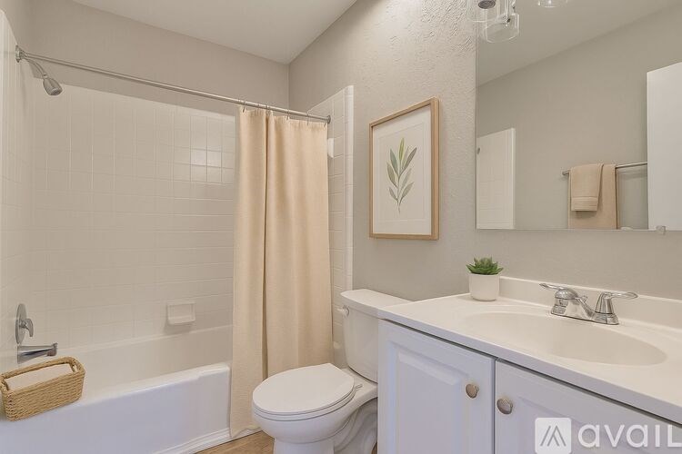 A room with a carpeted floor and a window.