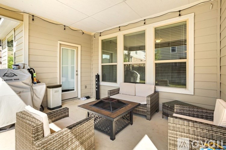 A patio with a table and chairs is shown.