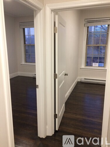 A room with a door and a window.