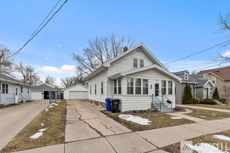 A house with a driveway in front of it.